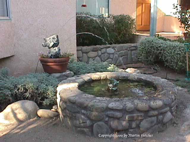 Fishy Fountain, Water spouting fish spray into a pond